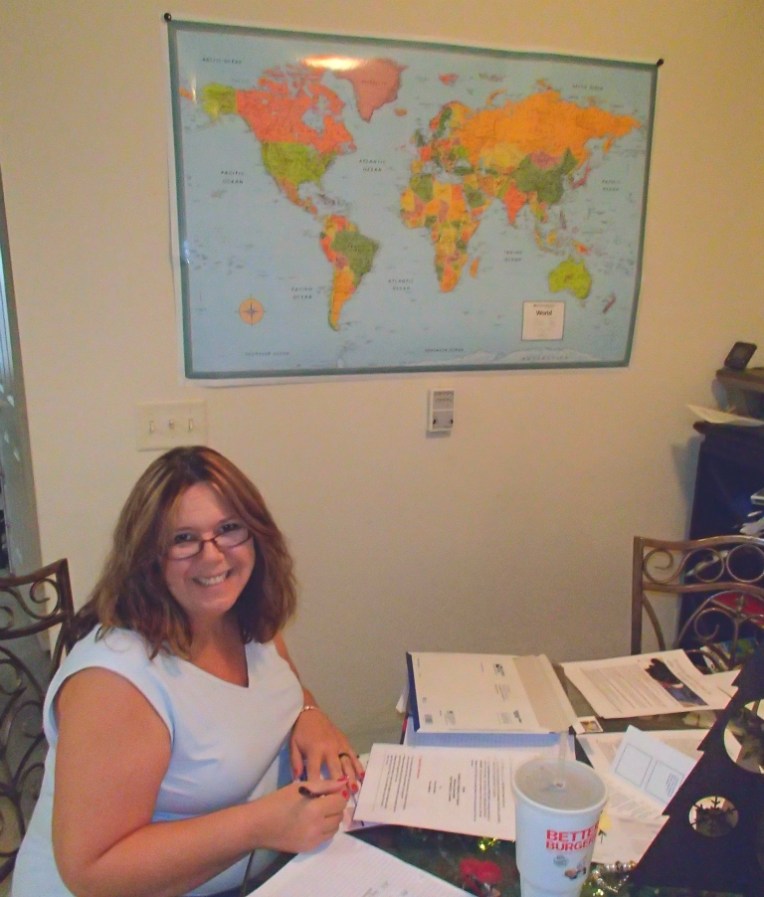 Tracy scanning and editing family photos.