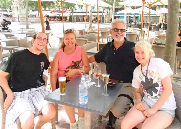 Adam, Tracy, Kiara, Alan, and Liz take a wine, beer, and champagne break in Place Carnot in the Bastide of Carcassonne