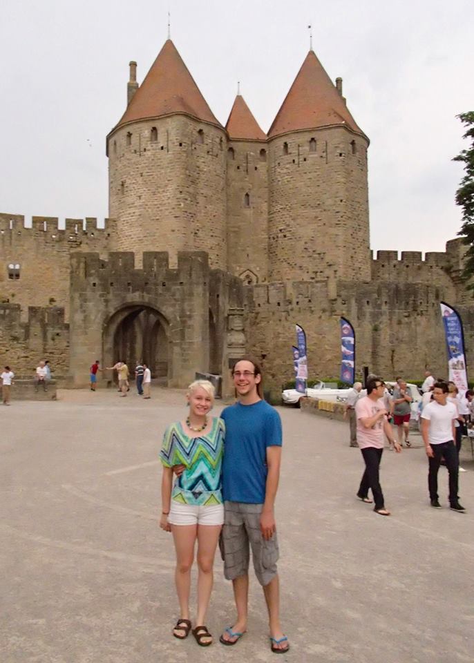 Adam and Liz in front of the Narbonne Gate of the medieval city la Cité de Carcassonne