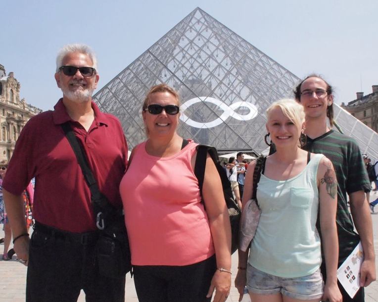 Alan, Tracy, Liz, and Adam in front of the Louvre pyramid.