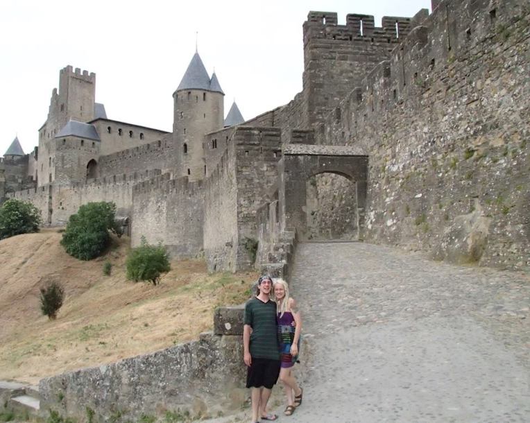 Adam and Liz in front of the Aude Gate of the medieval city la Cité de Carcassonne