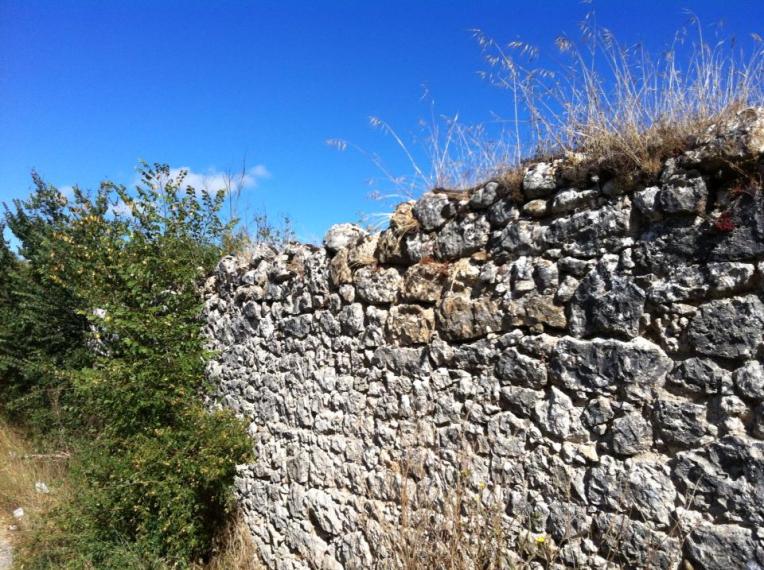 Rock retaining wall near Ages