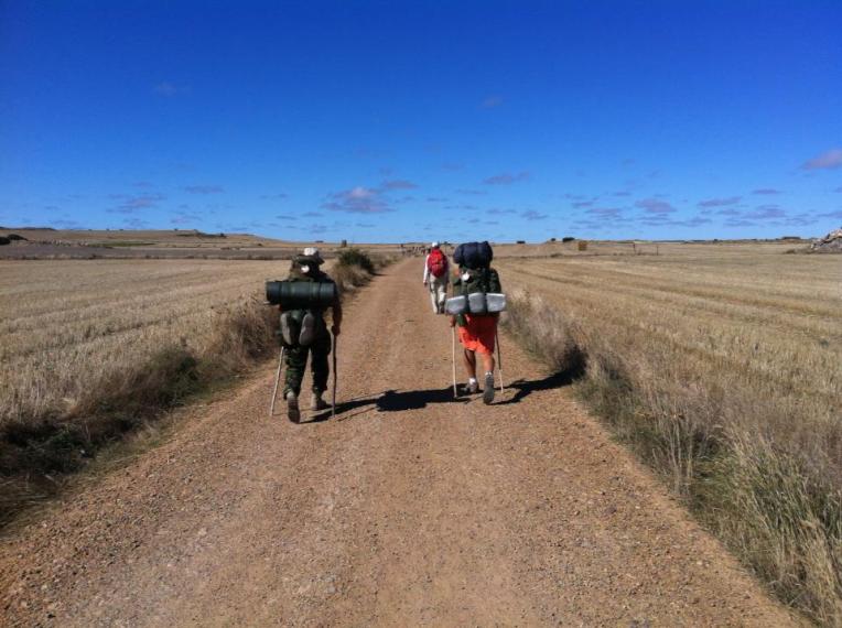 Pilgrim’s crossing the Meseta between Rabe de las Calzados and Hornillos del Camino 