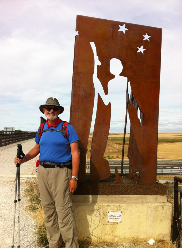 Alan at pilgrim sculpture on overpass near Itero de la Vega