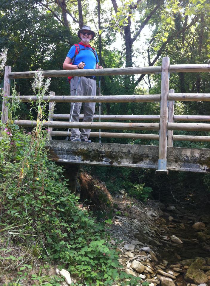 Alan crossing the wooden bridge at Irotz