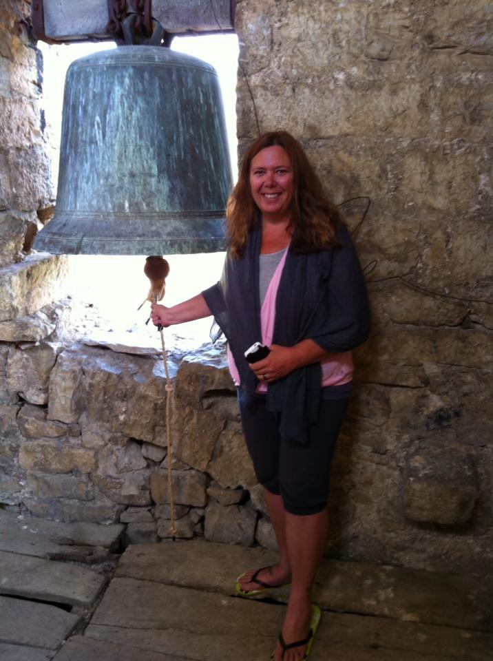 Tracy ringing the bell in Zabaldika, for luck