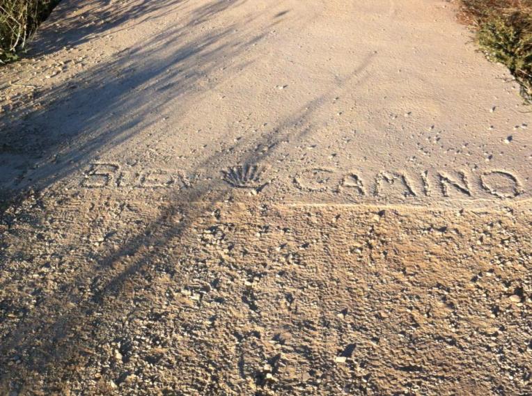 Buen Camino (Good Journey) in cement outside of Los Arcos