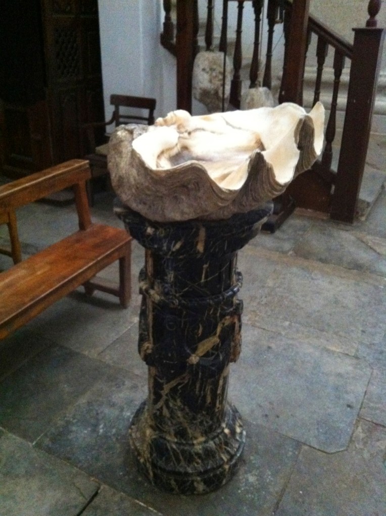 Holy water font made of a large scallop shell, its twin half is said to be in Rome, Chruch of Santiago, 