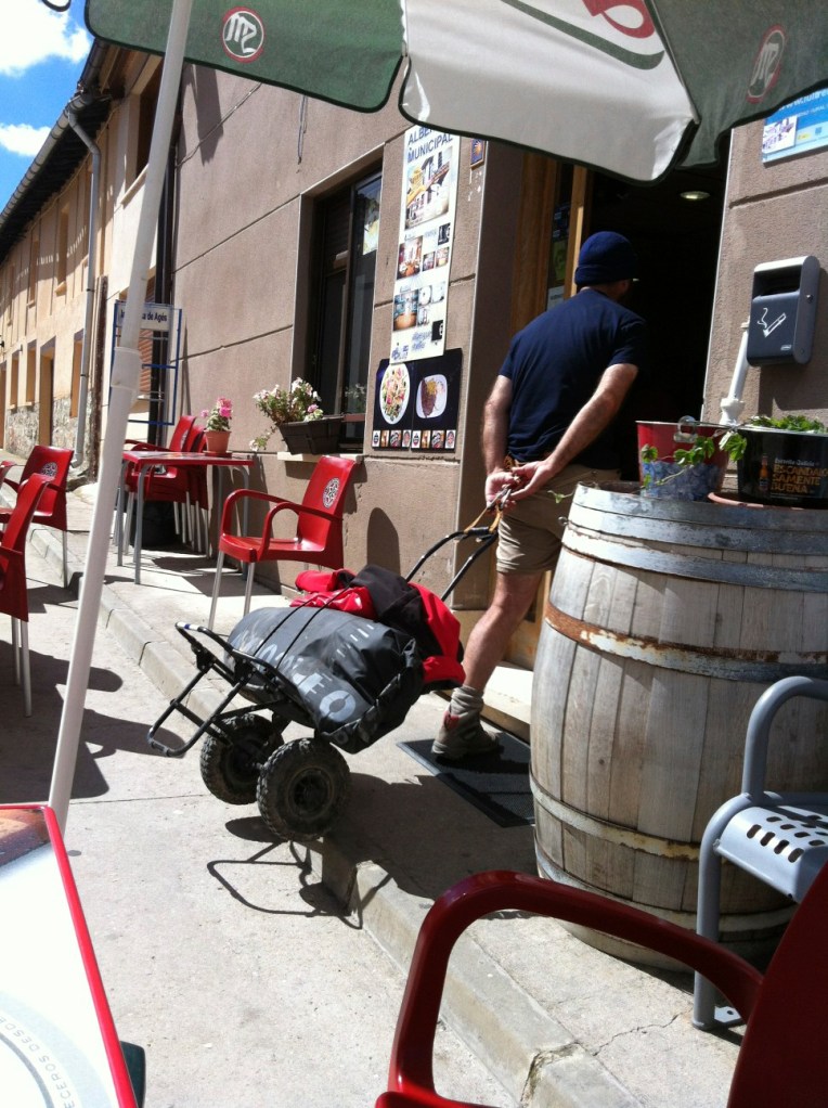 Clever pilgrim with home-made trailer