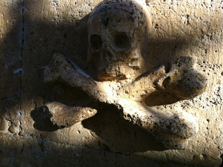 Skull and Crossbones detail, San Antón convent, 14th century