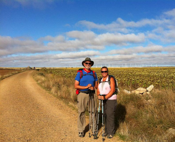 Camino | Alan and Tracy and view of a wind farm on the meseta of Spain