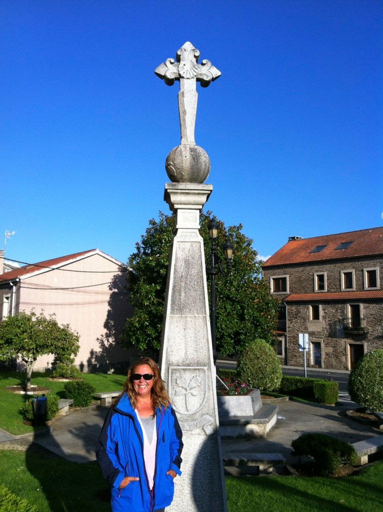 Tracy at monument with Cross of St. James in O Pedrouzo