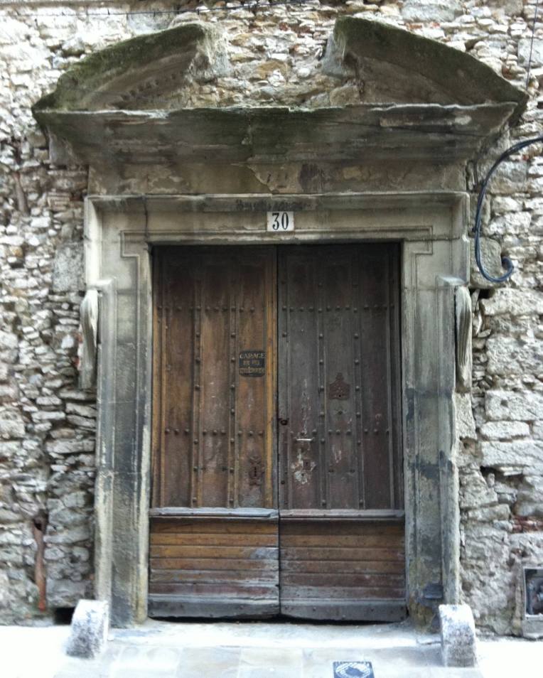 A striking antique door and frame on the Rue Coste Reboulh.