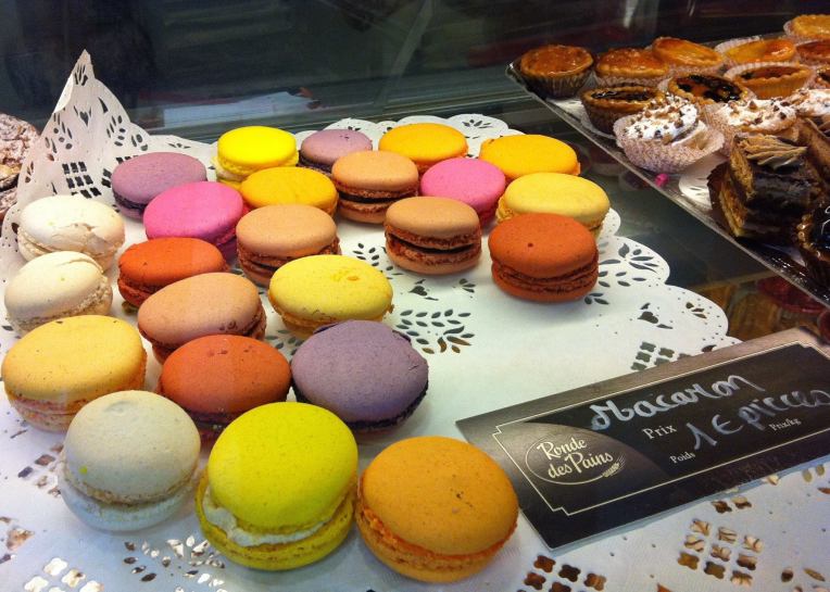 Macarons displayed at a pâtisserie.