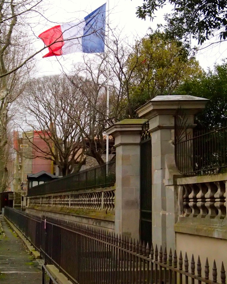 The French tricolor flying outside the Préfecture de l'Aude