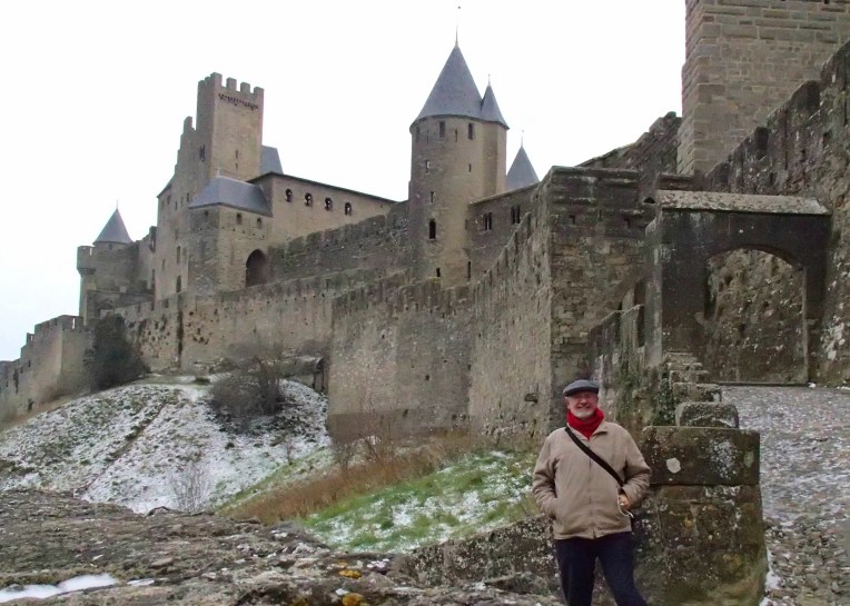 Alan standing near the Porte d'Aude (Aude Gate) entrance to le Cité de Carcassonne.