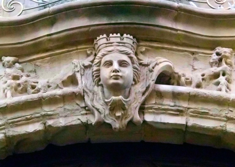 Ornamental lintel above the entrance to Hôtel de Rolland, an 18th century hôtel particulier which is now the Mairie (Town Hall)  on Rue Aimé Ramond