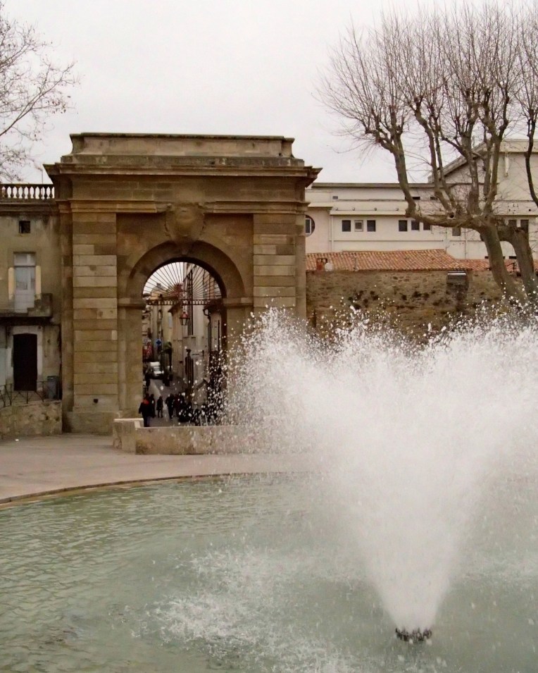 The fountain and Porte des Jacobins à Carcassonne (Jacobin Gate).