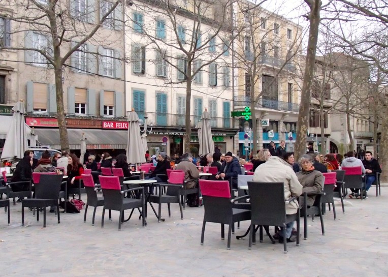 Patrons enjoying the cafes in Place Carnot (the town square.)
