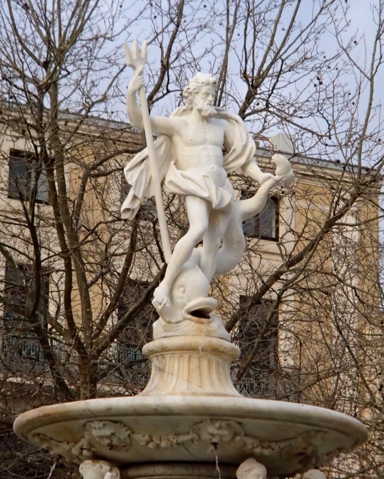 Statue of Neptune above the fountain in Place Carnot (the town square.)