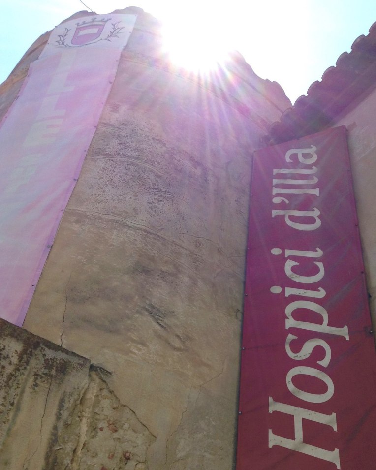 The current sign for the Hospice outside the gate near the rampart tower.