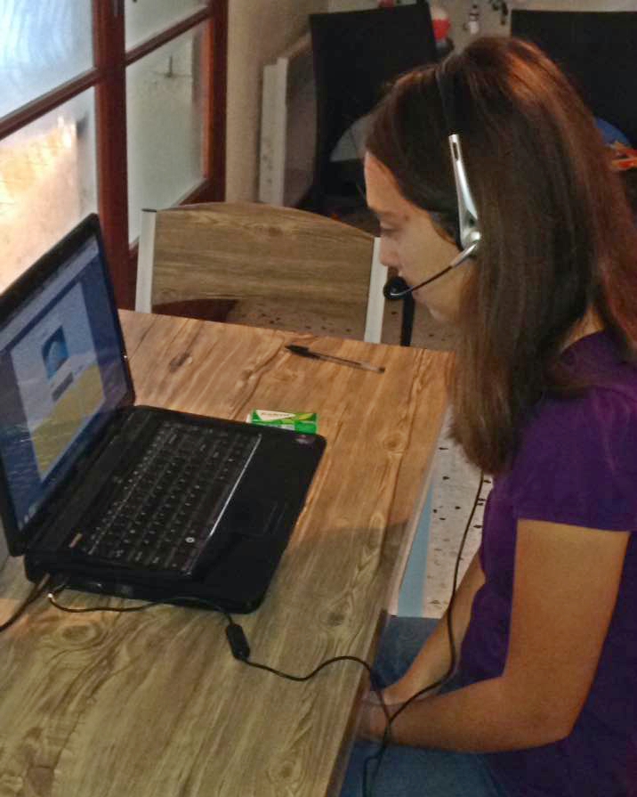 Etta working on her on-line high school course work.